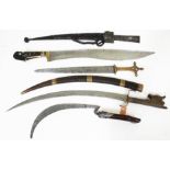 A group of five eastern short swords.