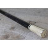 A 19th century rosewood walking cane with ivory handle, length 89cm.