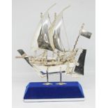 A model sailing ship on stand, marked 'Silver 925', height 15cm, wt. 3oz.