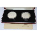 A cased set of two Zaire silver proof coins, Royal Mint, boxed with certificates.