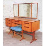 A G-Plan teak dressing table with triple mirror and stool, length 137cm, depth 50cm & height