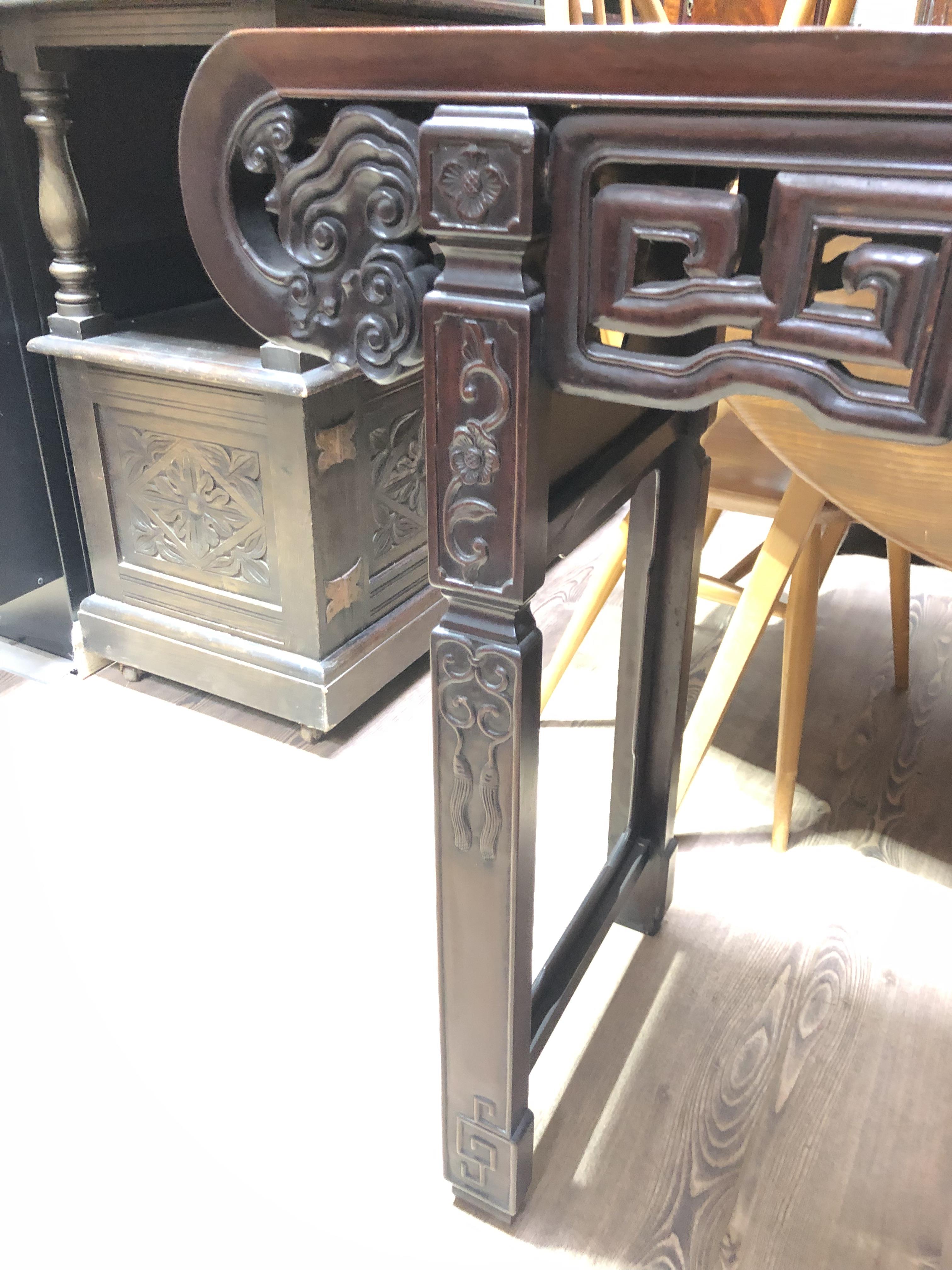 A Chinese altar table, late 19th century, carved frieze with scroll ends and carved square legs, - Image 10 of 12