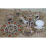 A Royal Crown Derby 1128 pattern 22 piece porcelain tea set comprising six cups, saucers and side