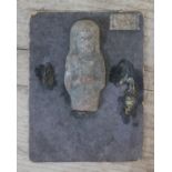 An Ancient Egyptian pottery ushabtis, length 5.5cm. Condition - broken and other half missing...