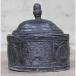 A Georgian lead tobacco jar of oval form with domed lid, the exterior decorated with Leeds coat of