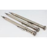 A group of three silver propelling pencils, 925 import marks.