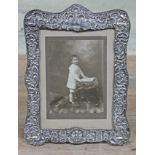 A hallmarked silver photograph frame, height 27cm.