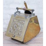 A Victorian Aesthetic style brass coal scuttle with shovel.