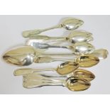 A group of hallmarked silver spoons comprising a Georgian serving spoon London 1796 and 11