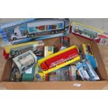 A box of mainly boxed die-cast trucks and cars, various manufacturers.