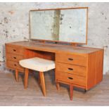 An Austinsuite teak dressing table with adjustable mirror, cut-out handles and stool, length