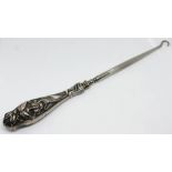 A silver handled Art Nouveau button hook, marked 'Sterling', length 22.5cm.