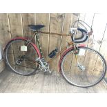 A vintage Raleigh 57cm road touring bicycle with mixed vintage components including Weinmann brake