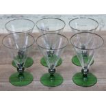 A set of four Art Deco glass drinking glasses, height 15cm. Condition - one with minor nibble to foo