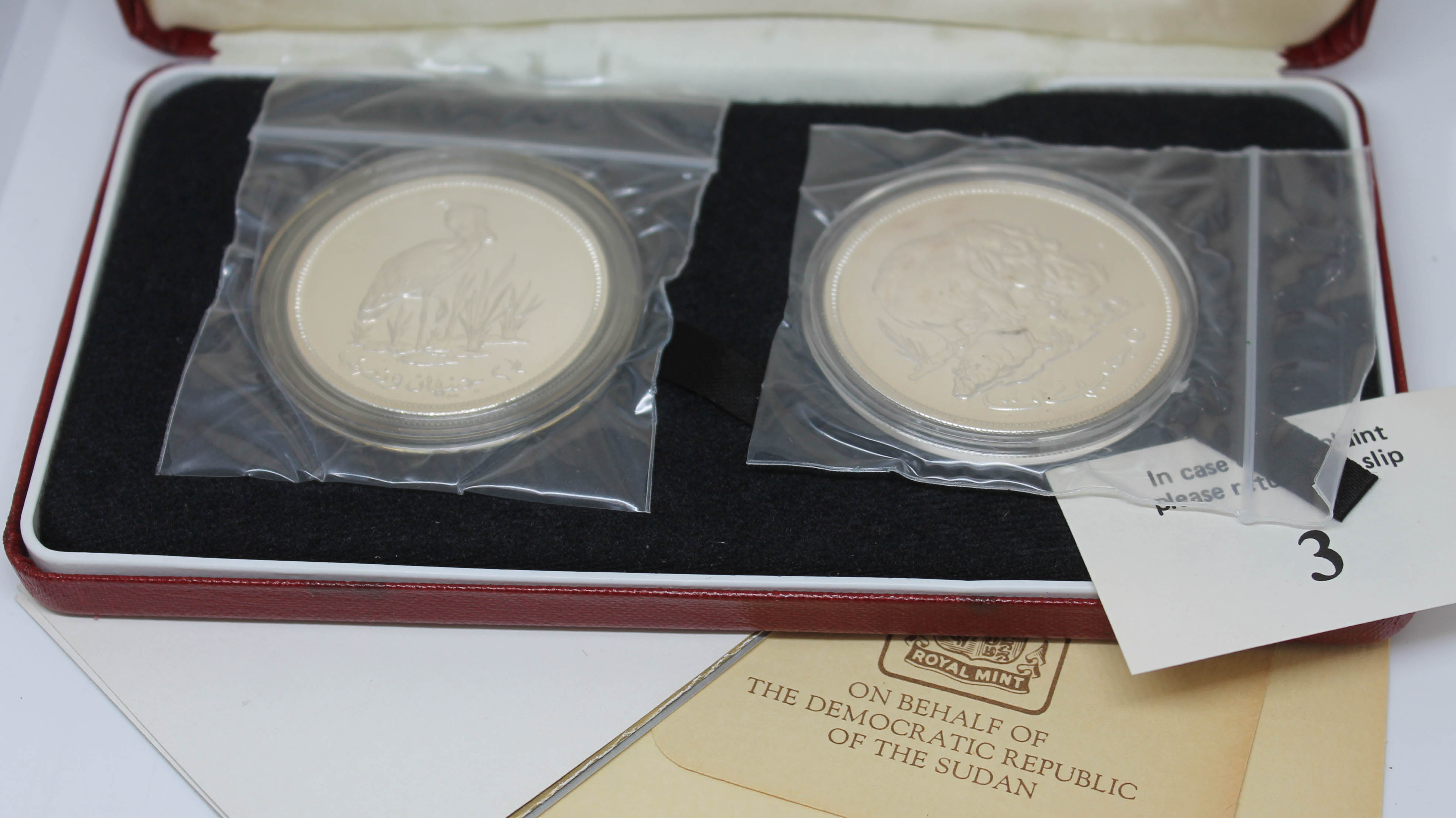 A cased set of two Sudan silver proof coins, Royal Mint, boxed with certificates.