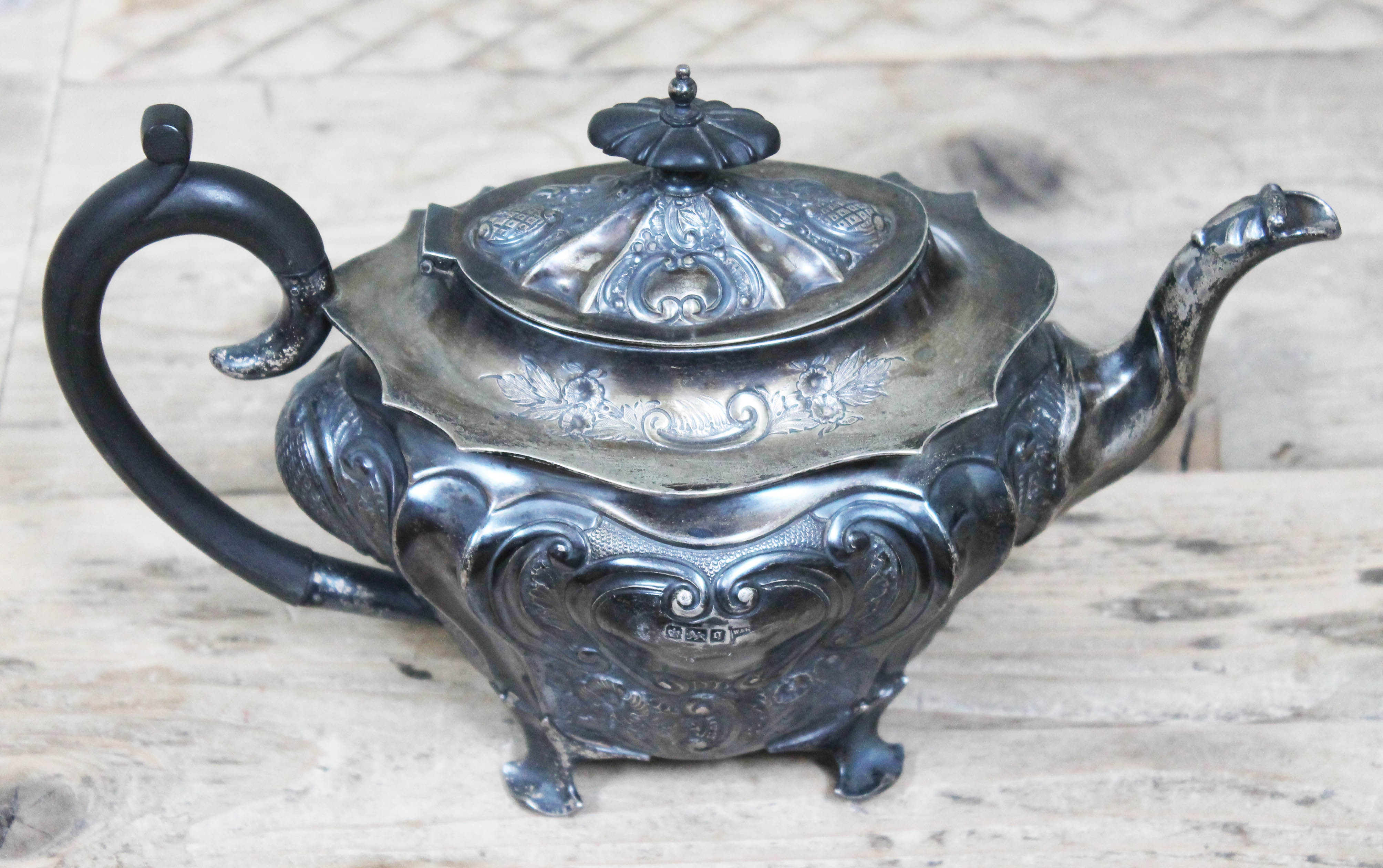 A hallmarked silver teapot, Walker & Hall, length 27cm, gross wt. 24oz.