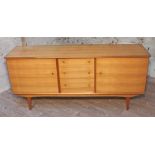 An Alfred Cox Kenton sideboard for Heals, in French walnut with gilt brass knobs, "Handcraft"