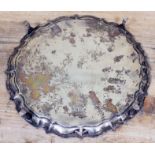 A four footed hallmarked silver salver, diam. 26.5cm, wt. 18oz.