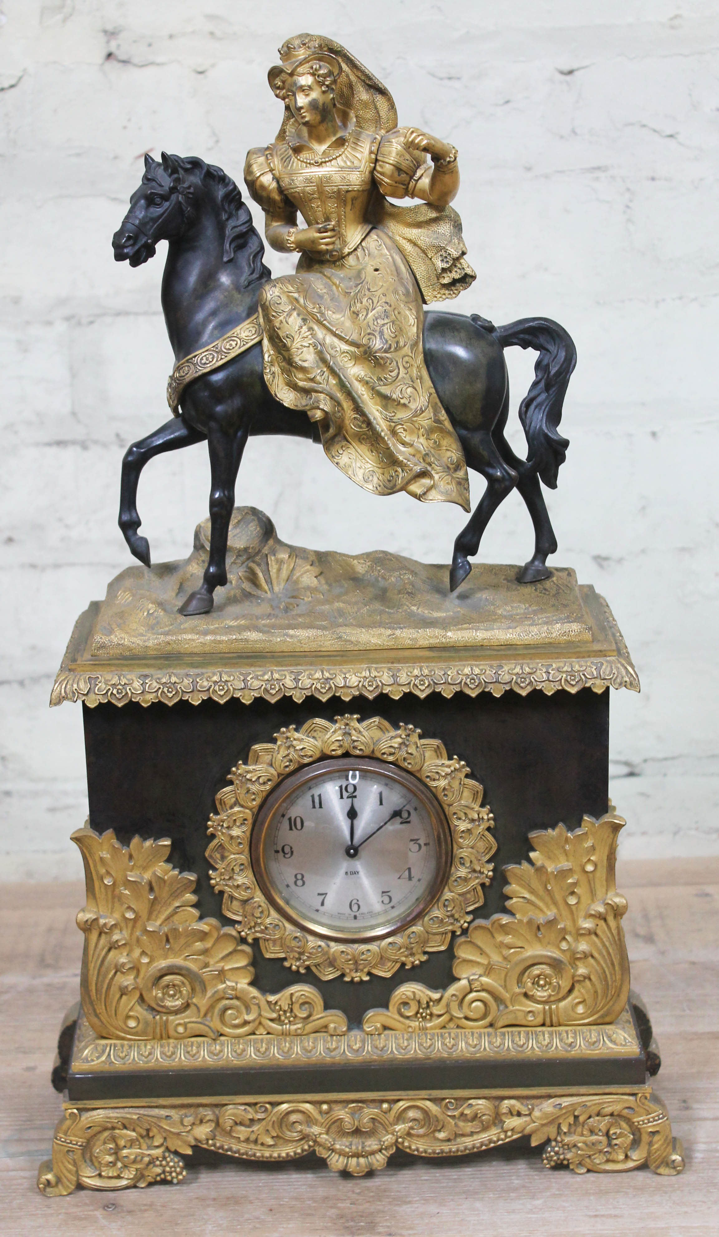 A French gilt metal figural mantle clock, height 56.5cm.