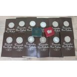 A group of silver proof Conservation Coin Collection coins with certificates, together with a 1973