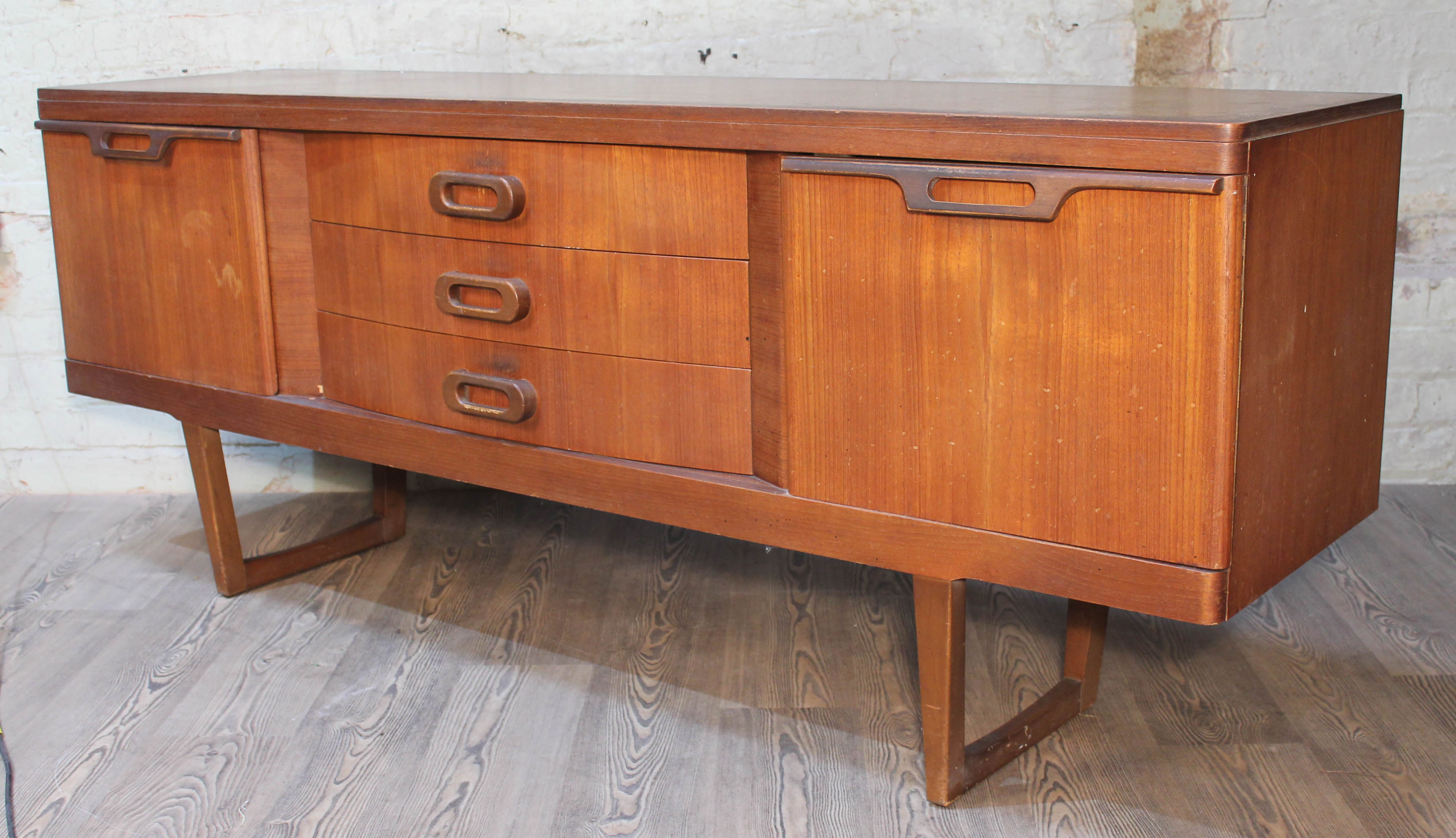 A teak sideboard, length 181cm, depth 47cm & height 72cm.