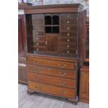 A Georgian 18th century and later inlaid mahogany bachelor cabinet on chest, having cornice top