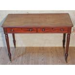 A 19th century mahogany side table with two drawers, turned legs and brass castors, width 114cm,