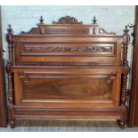 A French walnut double bed frame.