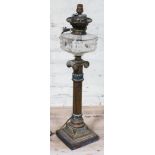 A Victorian brass lamp with cut glass reservoir, single column with acanthus mouldings and ionic