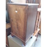 A mahogany cabinet containing vinyl classical records