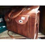 A vintage leather carrier bag in Gladstone manner
