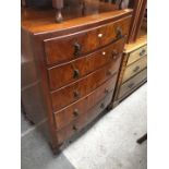 A bow front chest of drawers