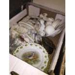 Box of assorted items including ribbon plates