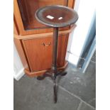 A tripod table with reeded column on pad feet