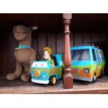2 Scooby Doo mystery machines and a toy Scooby