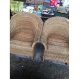 A pair of wicker chairs