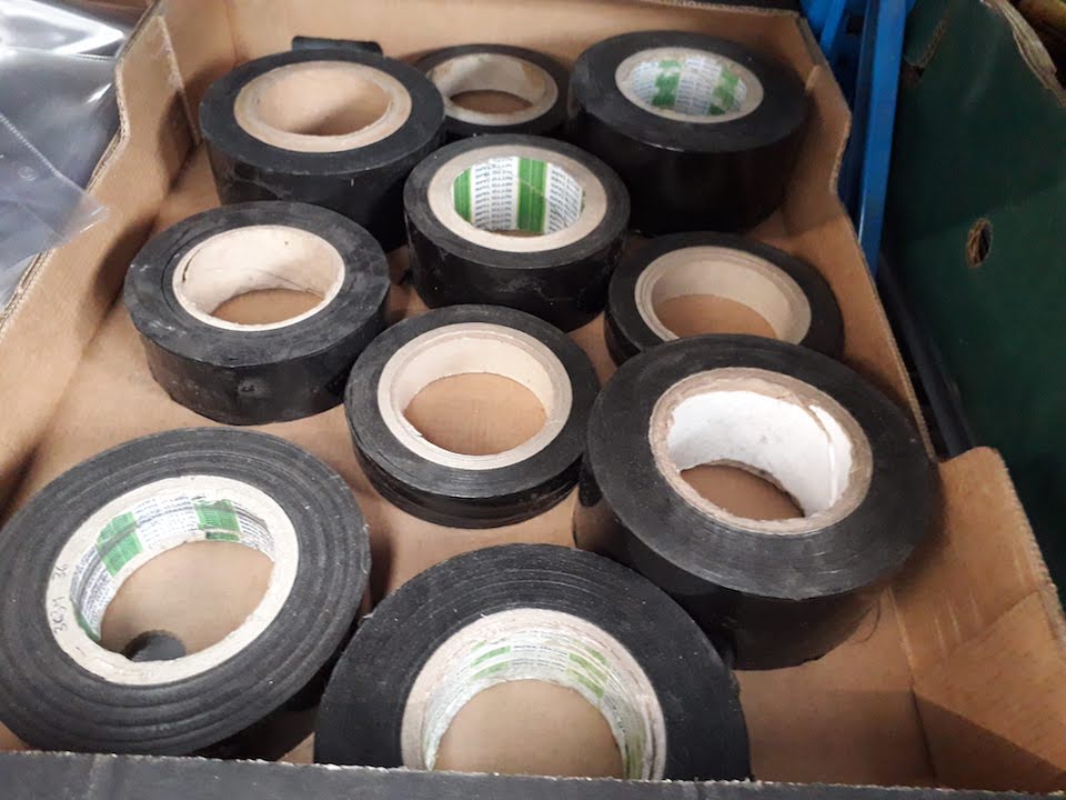 A box with 10 rolls black body tape