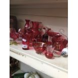 A collection of Victorian and later cranberry glass.