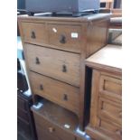 An oak chest of drawers