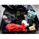 A suitcase of clothes and bric a brac