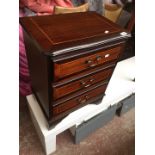 A small reproduction mahogany chest of 3 drawers