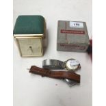 A Westclock travel clock in original case, a Waltham wristwatch and a Roamer watch