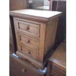 A pine bedside cabinet