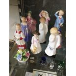 Nine small Royal Doulton figures and a posy