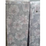 A floral patterned double divan bed and mattress