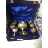 A box containing metal goblets