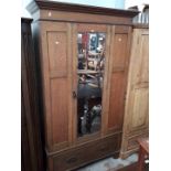 An oak mirror door wardrobe