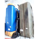 A garden sprayer and a jerry can