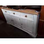 A white painted pine sideboard