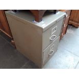 A vintage 2 drawer metal filing cabinet